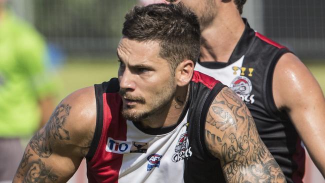 Josiah Farrer in a typical pose ... ball in hand and looking for teammates further down the ground. Picture: Glenn Campbell