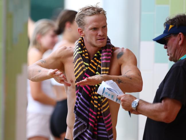 GOLD COAST, AUSTRALIA - APRIL 17: Cody Simpson speaks with coach Michael Bohl during the 2024 Australian Open Swimming Championships at Gold Coast Aquatic Centre on April 17, 2024 in Gold Coast, Australia. (Photo by Chris Hyde/Getty Images)