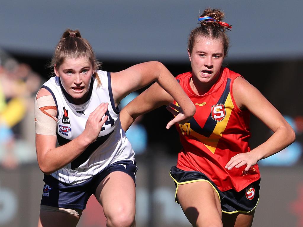 Vic Country’s Bianca Lyne and South Australia’s Keeley Kustermann run into the contest during the 2022 AFLW under-18 Girls Championships match between South Australia and Vic Country earlier this year. Picture: Sarah Reed/AFL Photos via Getty Images