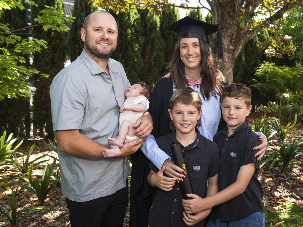 Master of Education (Guidance and Counselling) graduate Kirsten Doecke with husband Matt Doecke and their kids baby Ash, Taj and Jax (right) at a UniSQ graduation ceremony at The Empire, Tuesday, October 29, 2024. Picture: Kevin Farmer