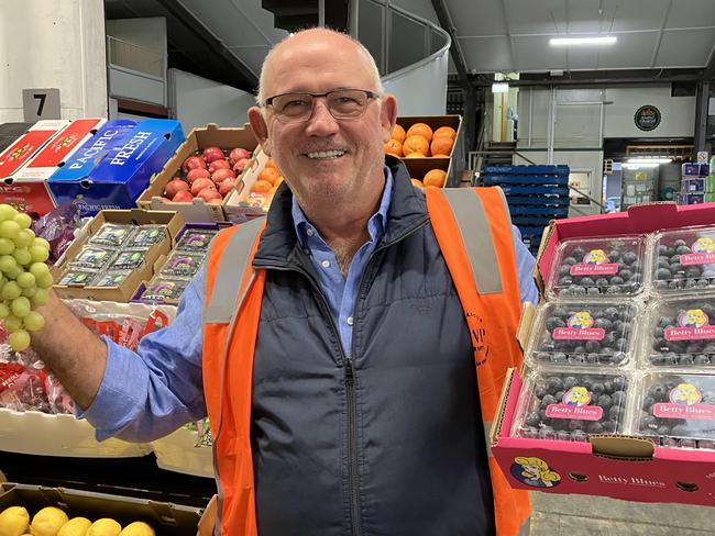 Melbourne Cup winning owner Noel Greenhalgh selling fruit at the Brisbane Markets. Picture: Ben Dorries