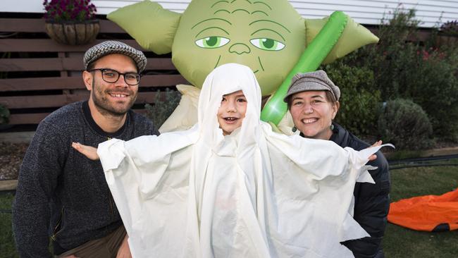 Archie Lyall, 4, with parents Gavin and Viv Lyall trick or treating on Halloween in Newtown, Sunday, October 31, 2021. Picture: Kevin Farmer