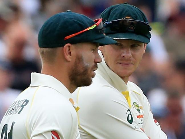 Ian Chappell says he can’t understand why Steve Smith (right) is allowed to return to an official leadership position but David Warner (left) is not. Picture: AFP