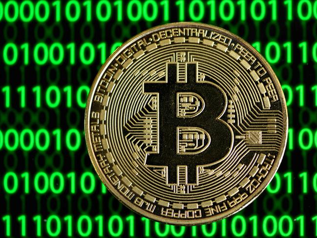 (FILES) In this file photo taken on January 27, 2020 a physical imitation of a Bitcoin is seen in Dortmund, western Germany. - German authorities said on March 15, 2023 they had taken down the "world's largest" money laundering site for cryptocurrency, seizing millions of euros' worth of bitcoin in the process. (Photo by INA FASSBENDER / AFP)