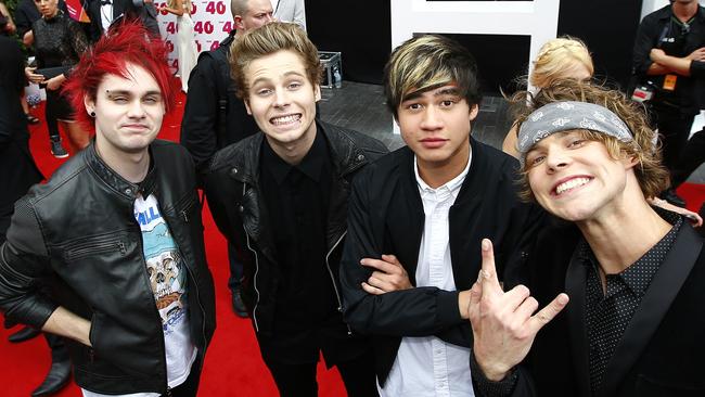 5 Seconds of Summer smile for the camera.