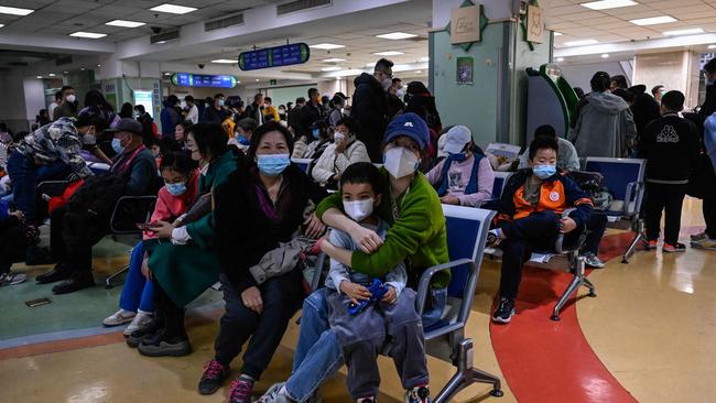 Children and their parents wait in an outpatient area of a children’s hospital in Beijing on November 23, 2023. Picture: AFP