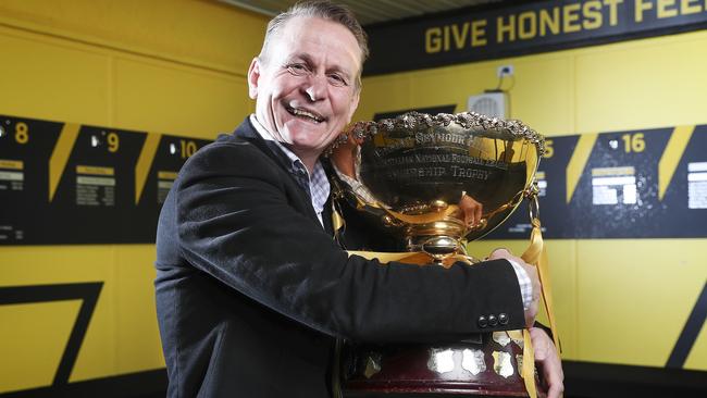 Outgoing Glenelg Football Club president Nick Chigwidden with the premiership trophy. Picture SARAH REED