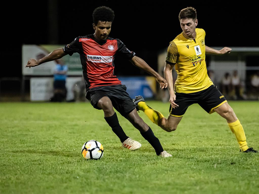 Leichhardt's Seamus Fowler and Edge Hill United's Joshua Taylor in the FNQ Premier League grand final between Edge Hill United and Leichhardt at Endeavour Park. Picture: Emily Barker