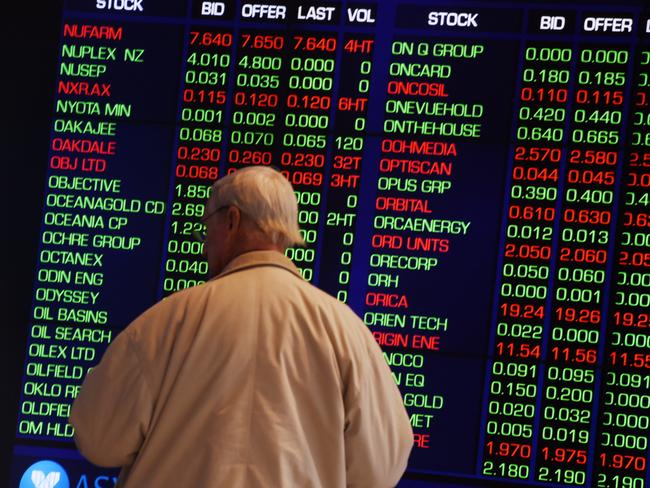 A man watches the stock boards at the Australian Stock Exchange as the market shows signs of a recovery following more positive news out of China, Sydney, Tuesday, July 28, 2015. The ASX 200 opened lower this morning following further falls in Chinese shares and commodity prices. (AAP Image/Dean Lewins) NO ARCHIVING