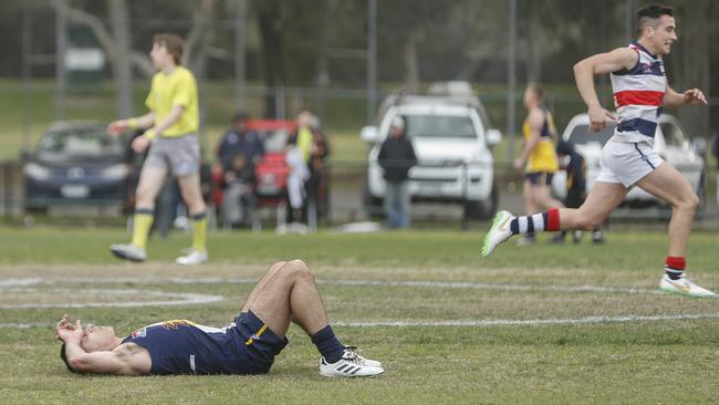 A dejected Doveton Eagles player after the siren. Picture: Valeriu Campan