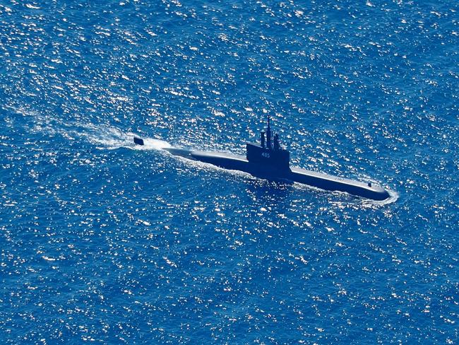 An aerial photo taken from a maritime patrol aircraft of 800 Air Squadron of the 2nd Air Wing of Naval Aviation Center (PUSPENERBAL), shows Indonesian Navy submarine KRI Alugoro sailing on a search mission for KRI Nanggala, a Navy submarine that went missing during a naval exercise, in the waters off Bali Island, Indonesia, 22 April 2021. The German-made submarine was reported missing on 21 April 2021 near the island of Bali with 53 people on board while preparing to conduct a torpedo drill, the the Indonesian National Armed Forces said. EPA/ERIC IRENG