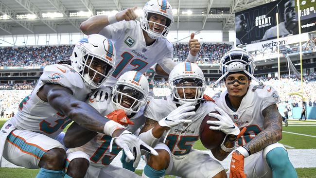 Dolphins players celebrate Jakeem Grant’s fourth quarter touchdown. Picture: AFP