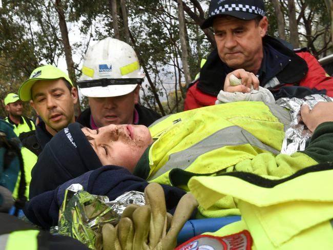 Found! Luke Shambrook is placed into an ambulance. Picture: Mike Keating