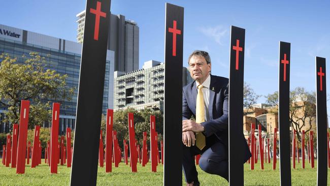 RAA senior manager of safety and infrastructure Charles Mountain with hundreds of roadside markers placed in the heart of Adelaide last year to represent all the people who lost their lives or were seriously injured in crashes across the state. Picture: Dean Martin