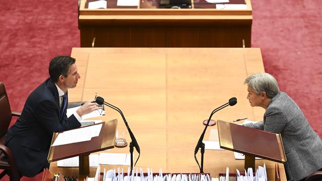 Retiring Liberal Senate leader Simon Birmingham talks across the table with his Labor counterpart Penny Wong. Picture: Martin Oldman/NewsWire