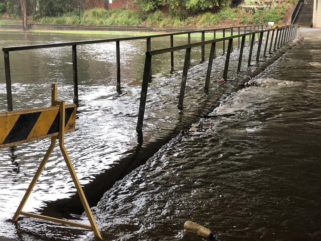 The Barry Wilde Footbridge is closed as the banks of the Parramatta river break during torrential weather in Sydney. Picture: Channel 10