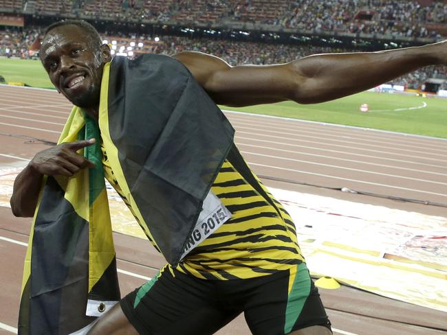 FILE - In this Aug. 23, 2015, file photo, Jamaica's Usain Bolt celebrates after winning the gold medal in the men's 100-meter ahead of United States' at the World Athletics Championships at the Bird's Nest stadium in Beijing. Even though David Rudisha, the 800-meter Olympic champion from Kenya, refers to Bolt as his brother from another mother, you really couldnâ€™t get two more contrasting characters. (AP Photo/Lee Jin-man, File)