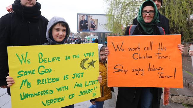 Turkish people in Ankara hold placards during a demonstration to condemn the mass shooting in Christchurch, New Zealand. Picture: Adem Altan/AFP