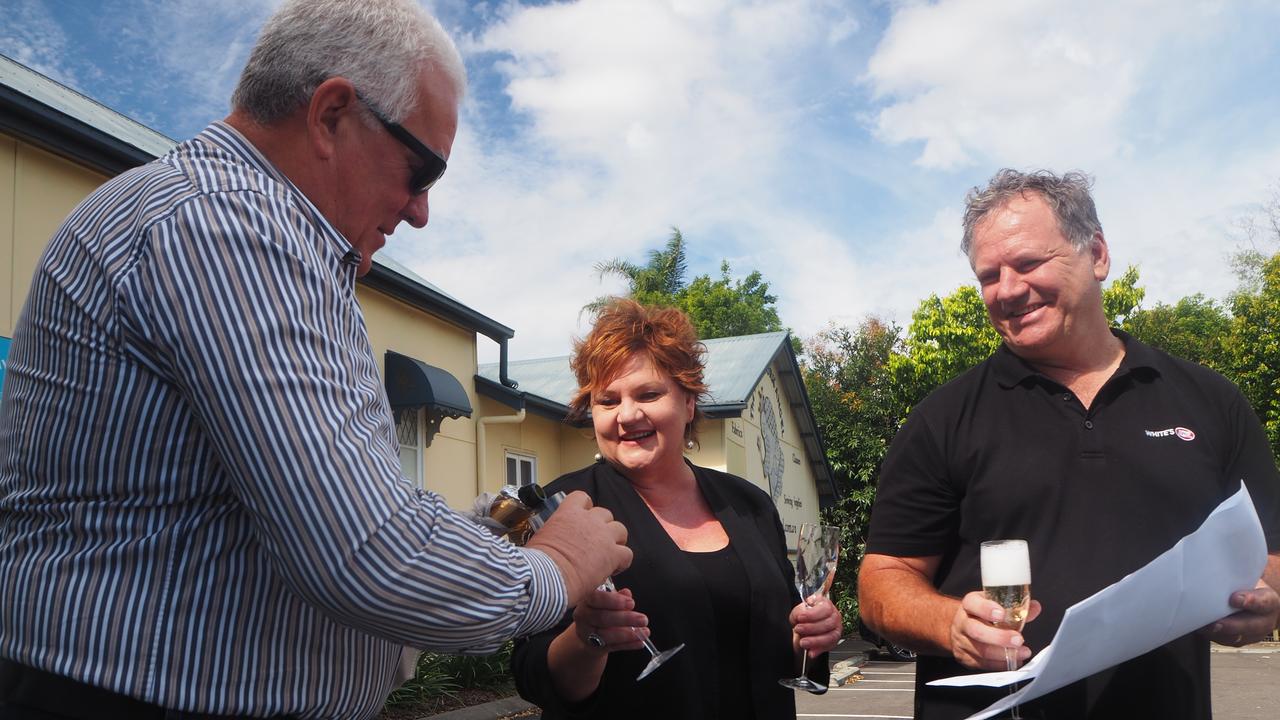 Sancus Property principal Tony Riddle and Whites IGA owners Ros and Michael White celebrate the approval of the Forest Glen Village Centre development in November 2020.