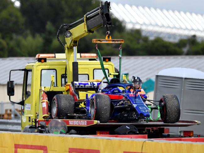 The car of Toro Rosso's French driver Pierre Gasly is transported off the track