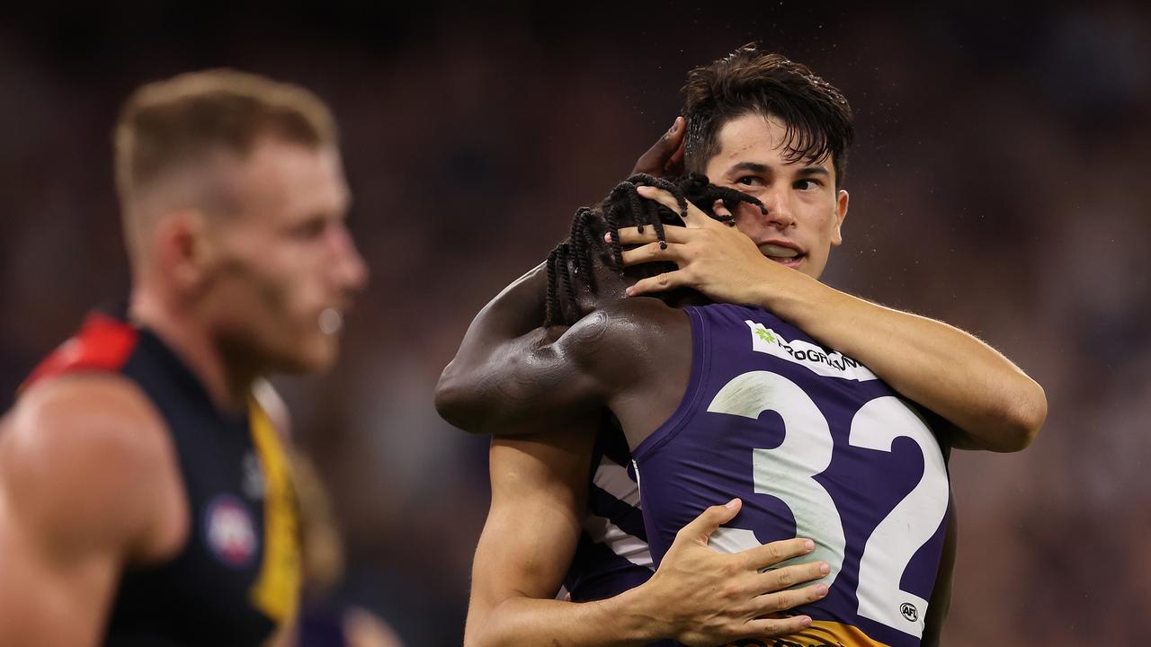 PERTH, AUSTRALIA - MARCH 29: Bailey Banfield of the Dockers celebrates a goal with Michael Frederick during the round three AFL match between Fremantle Dockers and Adelaide Crows at Optus Stadium, on March 29, 2024, in Perth, Australia. (Photo by Paul Kane/Getty Images)