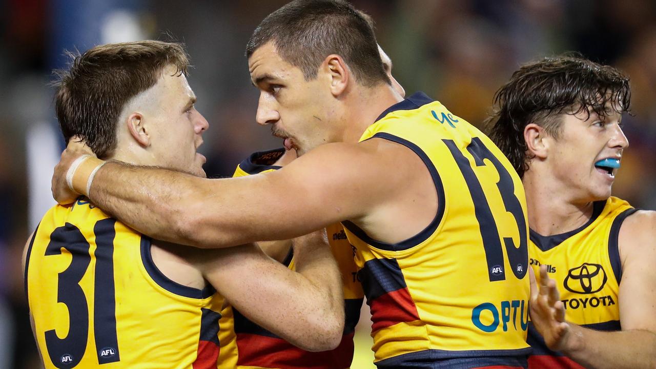 James Rowe (left) and Taylor Walker celebrate as the Crows get on top of the Roos.