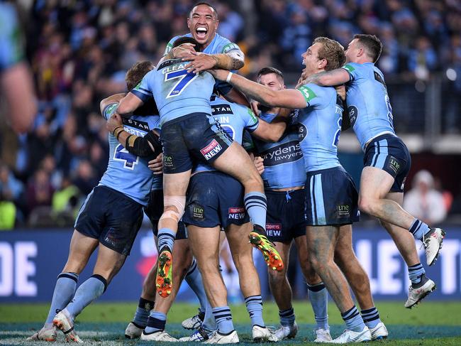 Blues players celebrate following their win over the Maroons during Game 2 of the 2018 State of Origin series. Picture: AAP Image/Dan Himbrechts