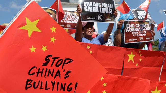 Activists in Manila protesting last year after a Chinese vessel collided with a Philippine fishing boat which sank in the disputed South China Sea, sparking outrage. Picture: AFP