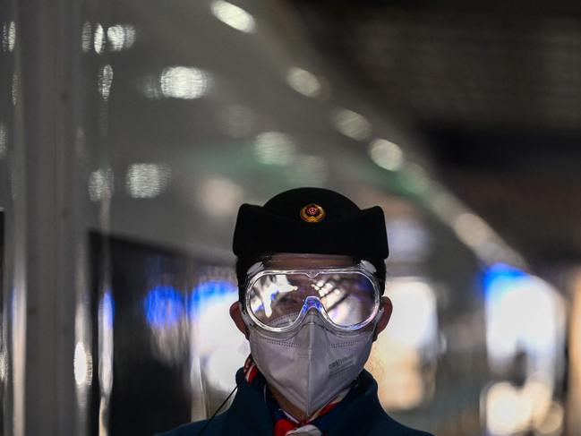 A Chinese security personnel stands guard at the Qinghe train station closed-loop bubble. Picture: AFP