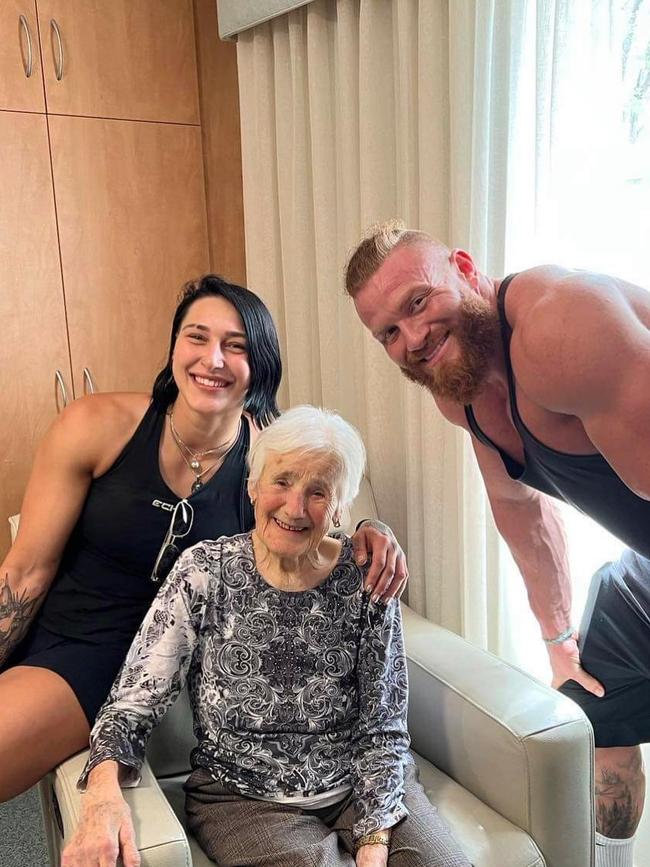 WWE star Rhea Ripley in Adelaide with her Nonna and her partner, fellow Aussie export and All Elite Wrestling star Buddy Matthews during a trip home in February. Picture: @rhearipley/Instagram