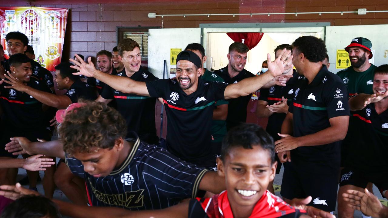 South Sydney Rabbitoh's Cody Walker leads his team in a traditional dance with Yarrabah children at Yarrabah's Jilara Oval. Picture: Brendan Radke