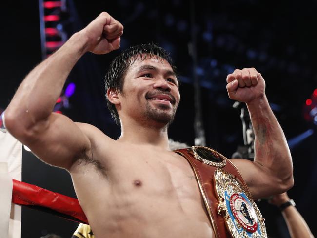 Pacquiao celebrates after defeating Jessie Vargas in their WBO welterweight title bout in Las Vegas last November. (AP Photo/Isaac Brekken)