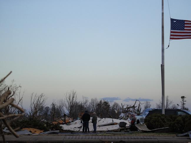 People survey tornado damage of the downtown area in Mayfield, Kentucky. Picture: AFP