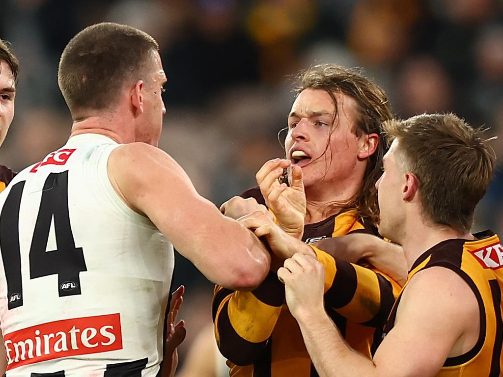 MELBOURNE, AUSTRALIA – JULY 20: Darcy Cameron of the Magpies and Jack Ginnivan of the Hawks have a disagreement during the round 19 AFL match between Hawthorn Hawks and Collingwood Magpies at Melbourne Cricket Ground on July 20, 2024 in Melbourne, Australia. (Photo by Graham Denholm/AFL Photos/via Getty Images)