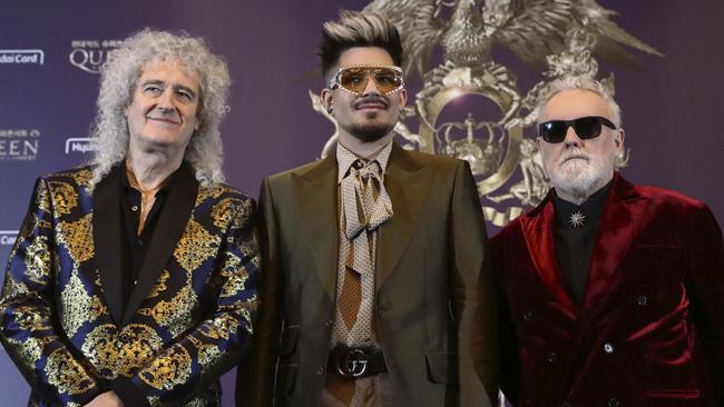 Brian May of Queen, Adam Lambert and Roger Taylor of Queen have donated Queen’s stadium staging for the Fire Fight concert. Picture: Chung Sung-Jun/AP