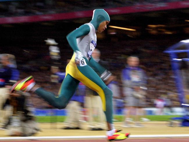 Cathy Freeman of Australia speeds over the track in the women's 400m final 25 September, 2000 at the Sydney Olympic Games. Picture: Eric Feferberg