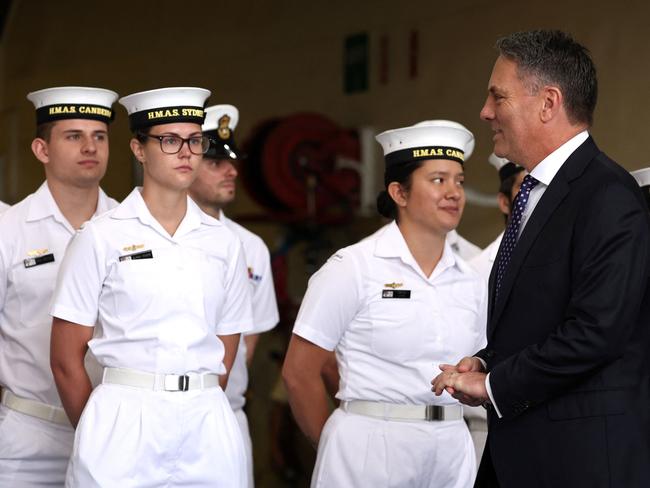 Australiaâs Defence Minister Richard Marles (2nd R) walks past sailors from the Royal Australian Navy aboard the Australian Navy ship HMAS Canberra in Sydney on February 20, 2024. (Photo by DAVID GRAY / AFP)