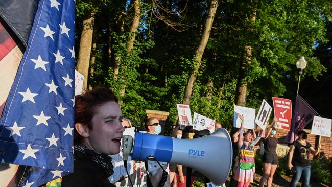 Demonstrators outside of Supreme Court Justice Clarence Thomas’ house called his wife Ginni an “insurrectionist.” Picture: Roberto Schmidt/AFP