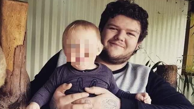 Alleged Burnie murder victim Bobby William Medcraft, 23, pictured with his young son. Picture: Facebook