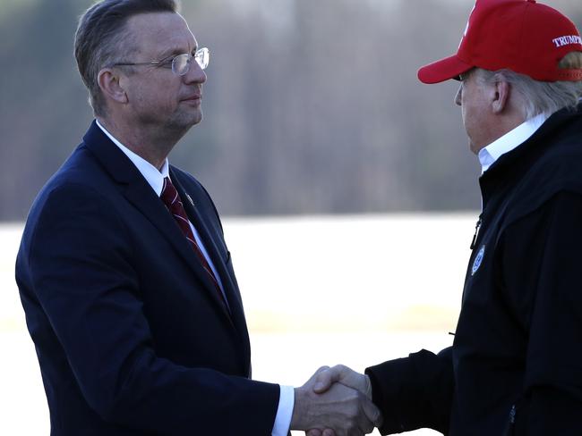 President Donald Trump greets Doug Collins. Picture: AP