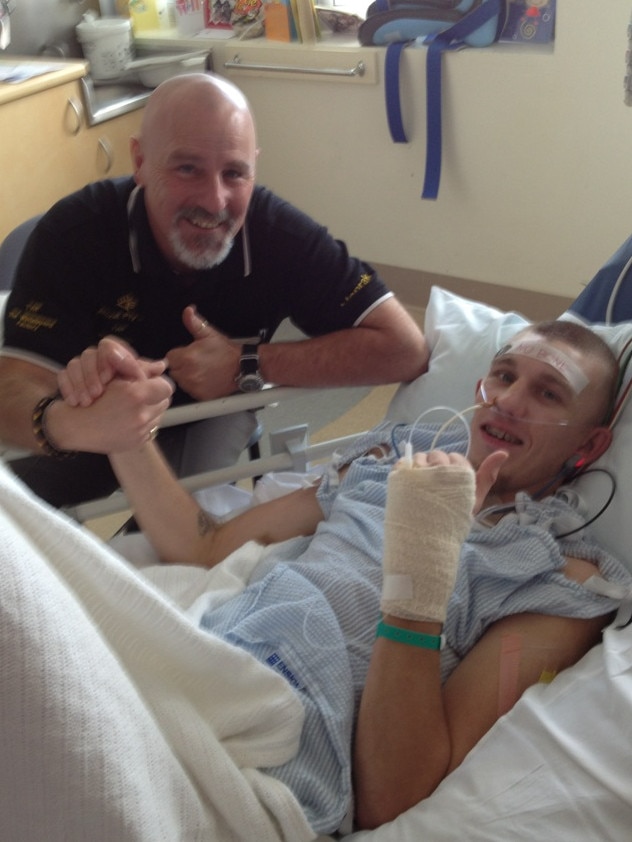 Mr Lindsley with his father, Doug, during his recovery.