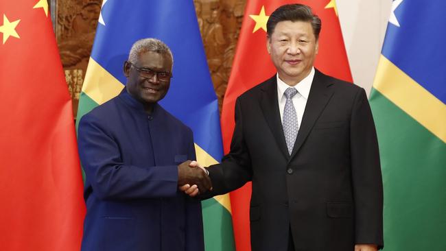 Xi Jinping (R) shakes hands with Prime Minister Manasseh Damukana Sogavare in Beijing in 2019. Picture: Getty Images.