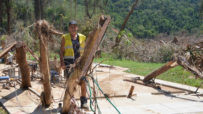 Mark Cassar stands amid the ruins of missing man Ray Dark's home at Degarra. Picture: Bronwyn Farr