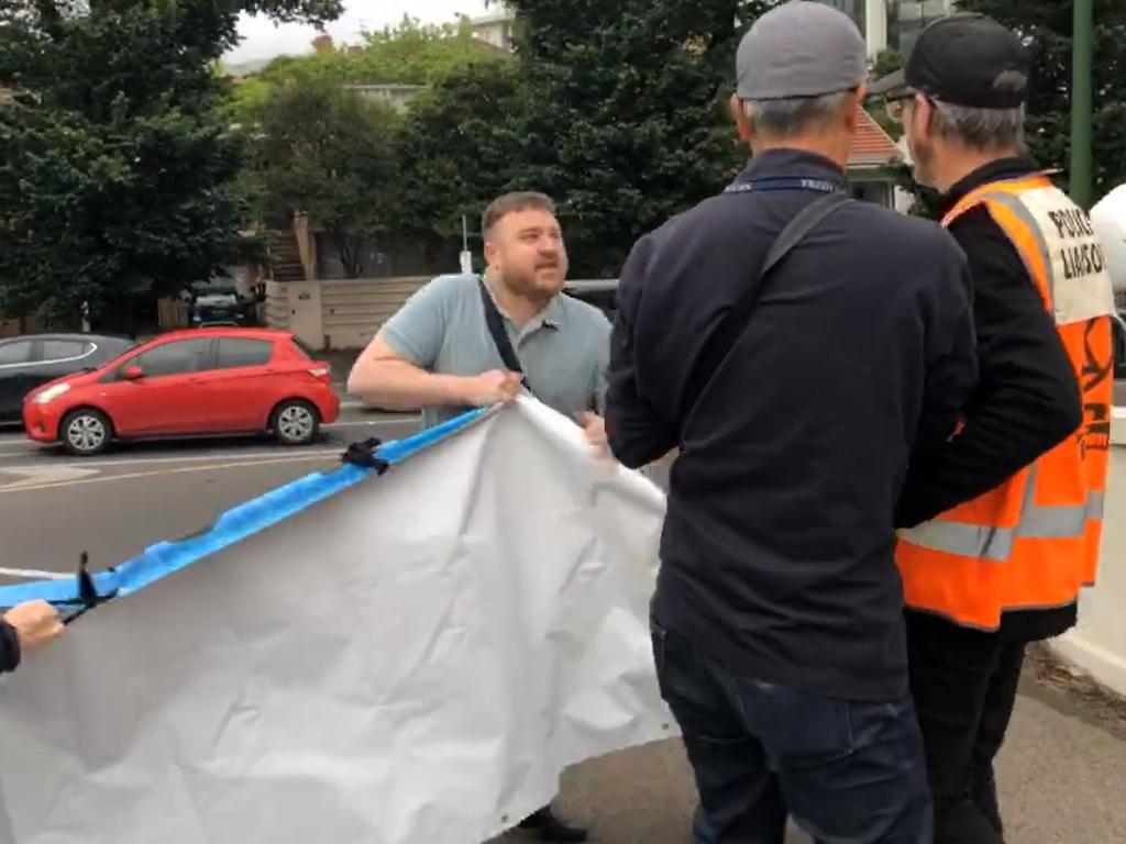 One angry driver got out of the car and ripped the protester’s sign.