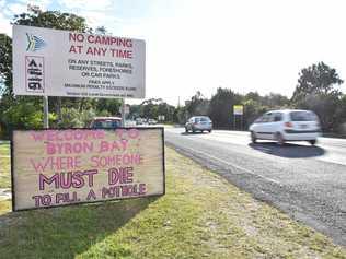 Signs placed at the southern and northern entrances to Byron Bay making it clear potholes should be fixed. Picture: Samantha Elley