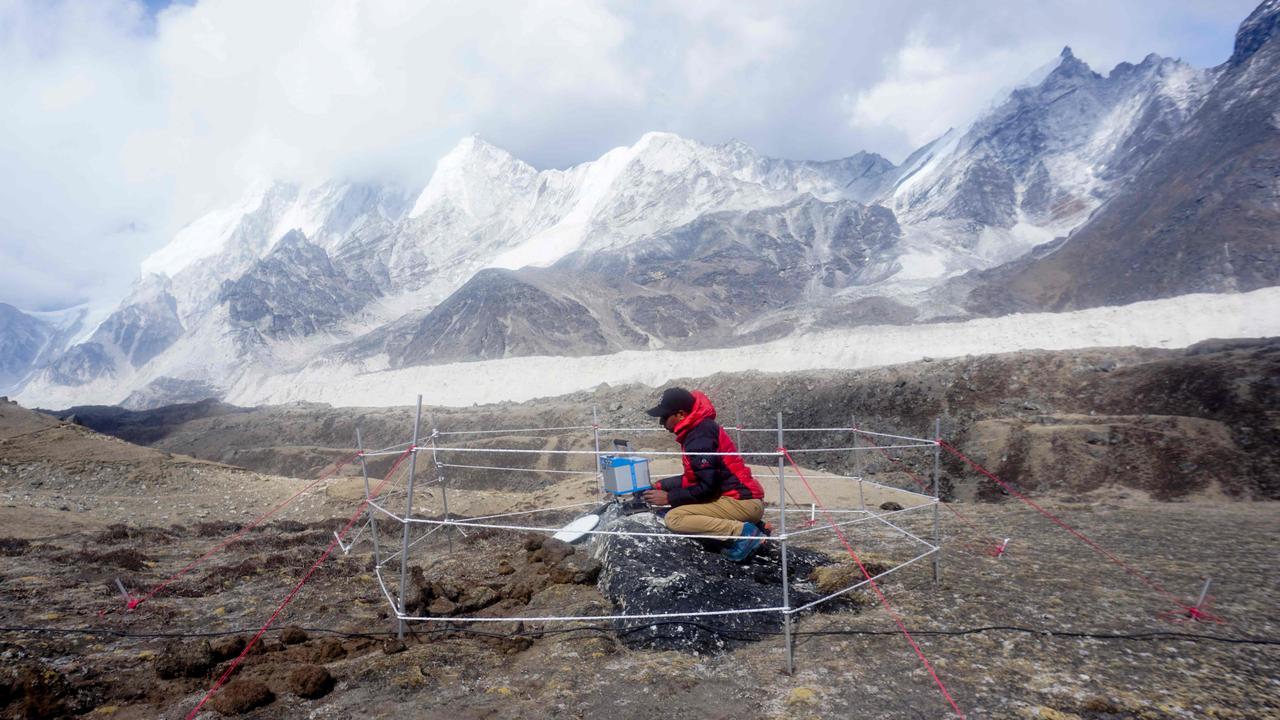 A Nepalese Survey Department team member conducts a gravity survey during Mount Everest height measurements. Picture: AFP/Survey Department, Nepal