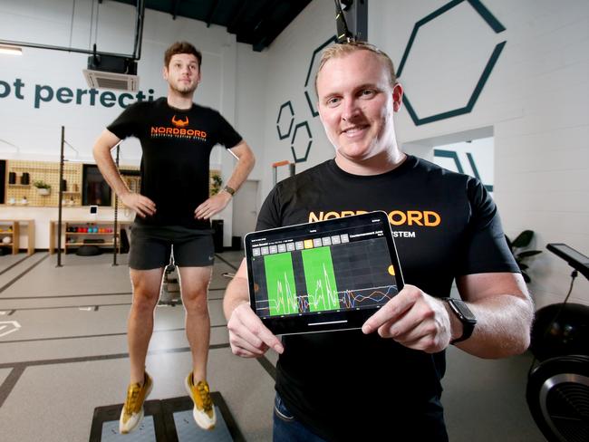 Sam James (right), VALD co-founder with Leonardo Murabito, on the Forcedecks using real time strength 7 performance software,  VALD is a high performance sport software company working with major sport organisations around the world, Future Brisbane Olympics, Newstead, Monday 8th November 2021 - Photo Steve Pohlner