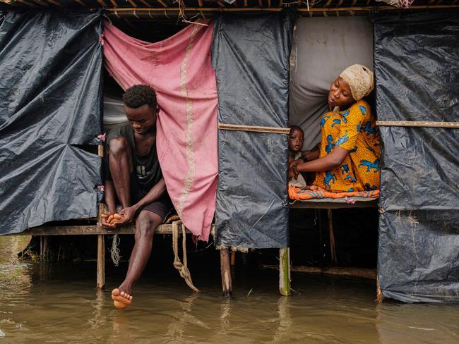 Uwurukundo Zilfa sits with her family in a temporary shelter in Bujumbura’s Gatumba district after being displaced by flash floods. Burundi’s government and the UN are seeking aid to address the impacts of ongoing heavy rains that have displaced nearly 100,000 people. Picture: Tchandrou Nitanga/AFP