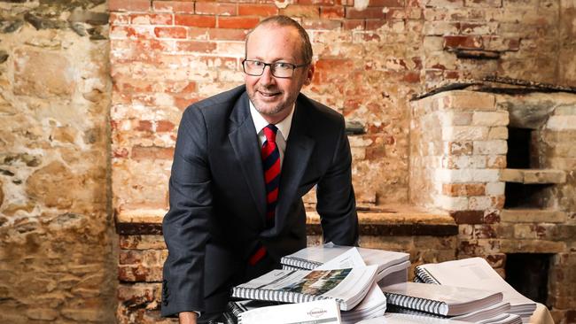 Terramin Australia chief executive Richard Taylor with the 6000 pages of regulatory documents amassed in support of the proposal.