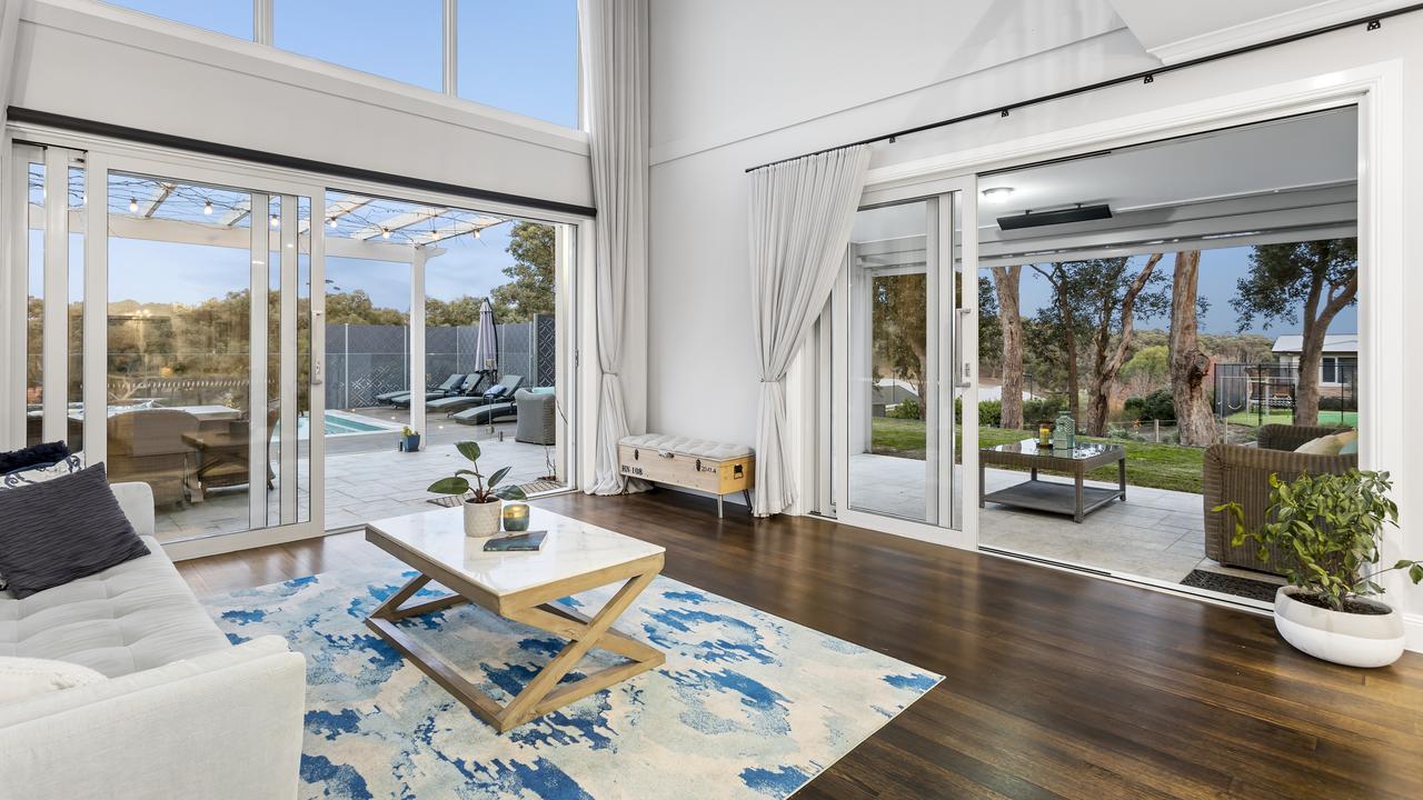 Soaring ceilings and big windows add to the home’s spacious feel.